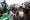 Palestinians gather to receive hot meals distributed by aid organizations in Gaza