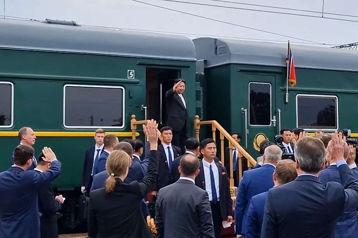 Kim Jong Un waves before boarding a train at the end of his visit to Russia. AFP
